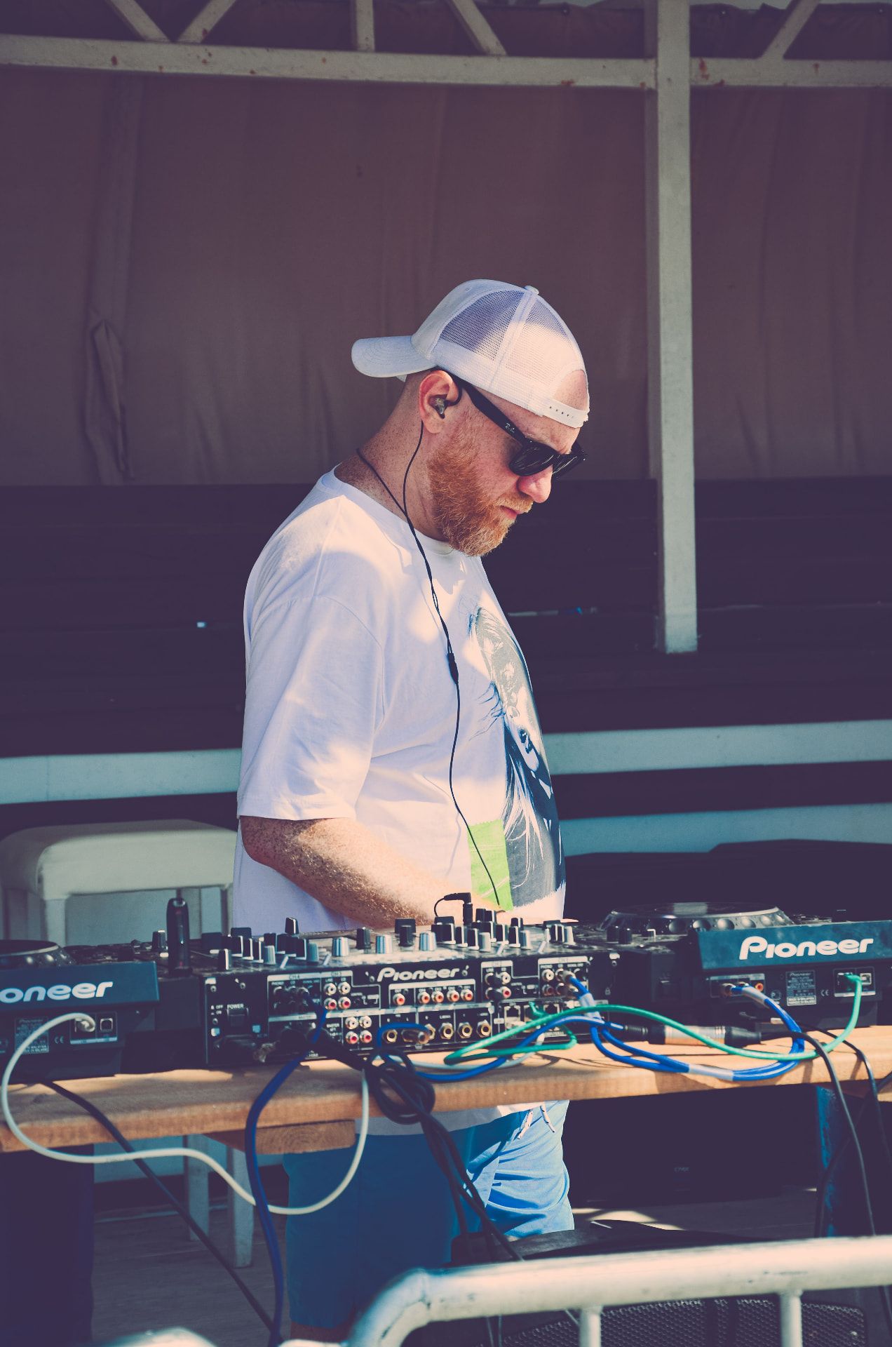 DJ performing at an outdoor summer event